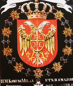 The dynastic coat of arms of the King of Milan as a knight of the World Order of Seraphim